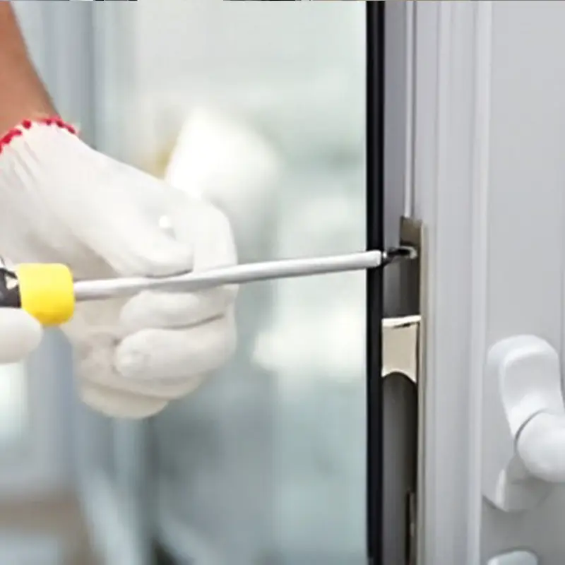Technician repairing a sliding glass door in a Maricopa home, working on lock, rollers, and track with professional tools