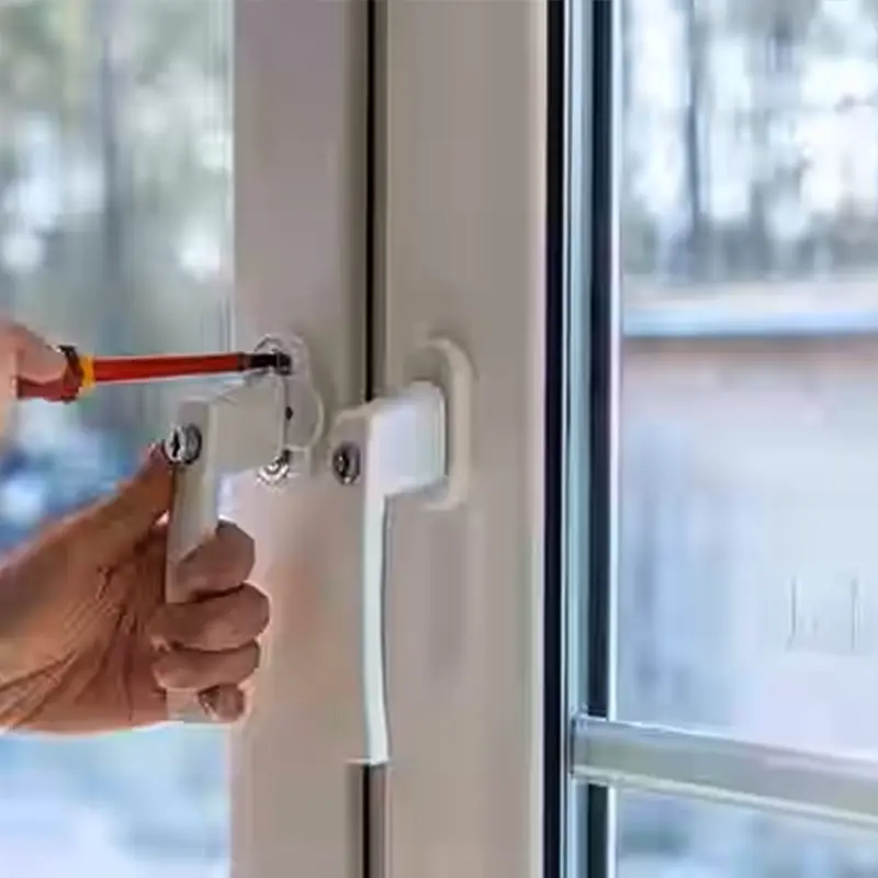 Technician repairing a sliding glass door in an Oracle home, working on lock, rollers, track, and screen door with tools