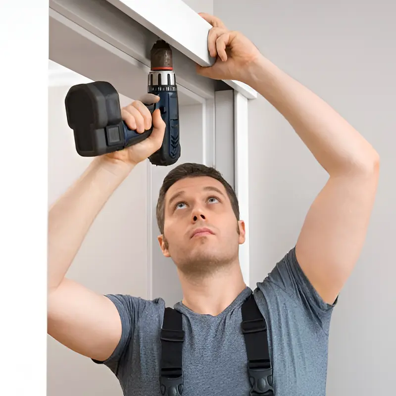Technician repairing a sliding glass door in a Peoria home, fixing rollers, lock, track, and screen door with professional tools